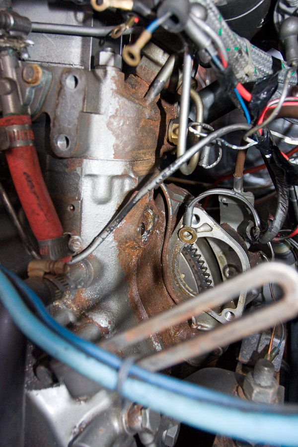 I could not remove the sacrificing anode - bolt heads were rounded. On the photo: alternator and starter are removed, anode bolt